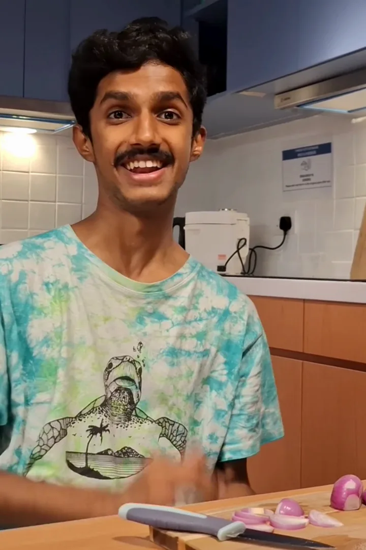 Adip, a Stride resident and HKU Master of AI in Business student, in the shared kitchen at Stride student co-living, Wong Chuk Hang, Hong Kong